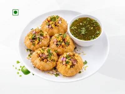 A plate of 5 crispy ready-to-serve Fulki Pani Puri pieces filled with spiced potatoes and tangy mint water by Wheeler's Food.